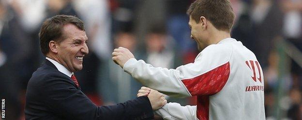 Liverpool manager Brendan Rodgers celebrates with Steven Gerrard