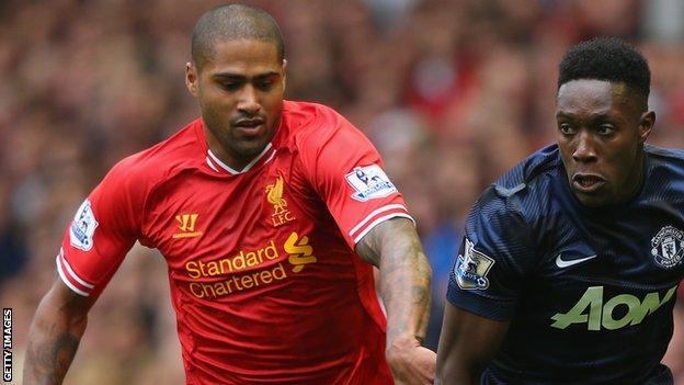 Liverpool's Glen Johnson battles with Danny Welbeck of Manchester United
