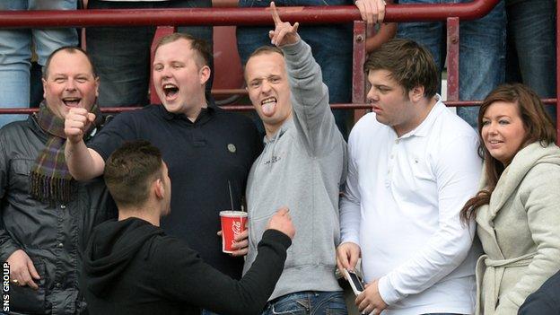 Leigh Griffiths (centre) was among the Hibs supporters at Tynecastle on Sunday