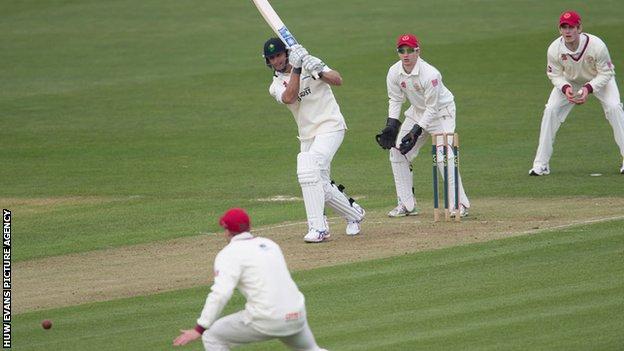 Chris Cooke on-drives for Glamorgan against Cardiff MCCU