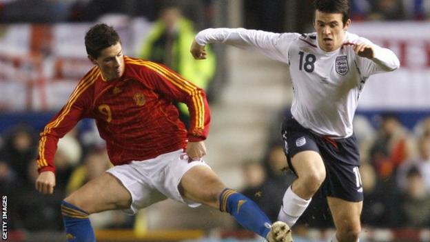 Joey Barton wins the ball from Fernando Torres in his only England appearance against Spain
