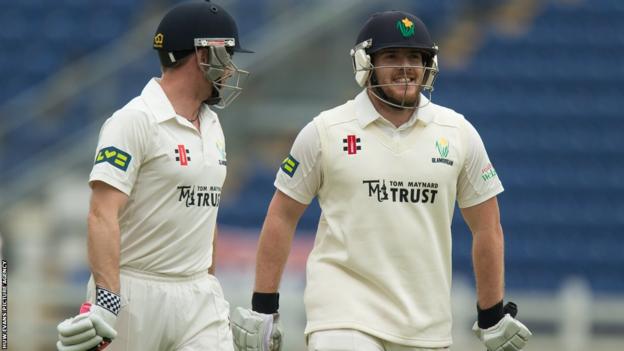 Mark Wallace and Will Bragg leave the field after Glamorgan declare their second innings against Cardiff MCCU in a game which ended in a draw because of rain.