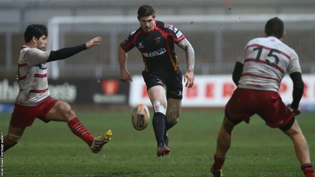Dragons try scorer Ross Wardle kicks the ball during his side’s Pro12 defeat at home to Edinburgh.