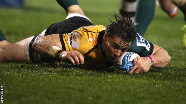 Ben Foden slides in a try for Northampton Saints against Sale Sharks