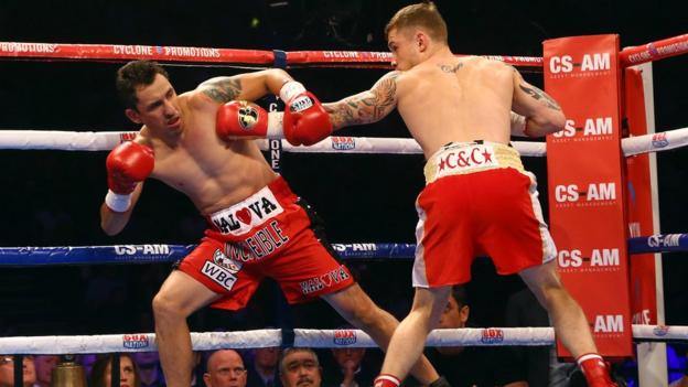 The 36-year-old Cazares reels from a body shot as Frampton chases a quick victory in Belfast