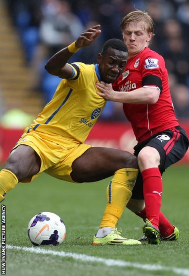Palace's Yannick Bolasie holds off Cardiff's Mats Moller Daehli