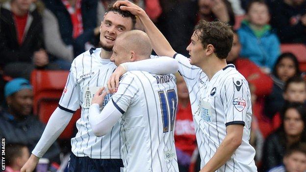 Millwall's Scott Malone (left) is congratulated by team-mates after his goal at Nottingham Forest