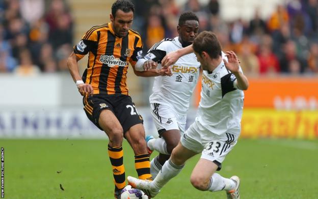 Hull City's Ahmed Elmohamady is tackled by Swansea City's Ben Davies in a match which the home side won 1-0.