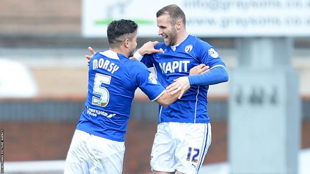 Jimmy Ryan celebrates with team-mate Sam Morsy after giving Chesterfield the lead against Newport County.