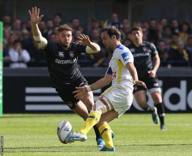 Clermont Auvergne’s Morgan Parra kicks the ball past Leicester’s Welsh fly-half Owen Williams during the Heineken Cup quarter final at Stade Marcel Michelin.