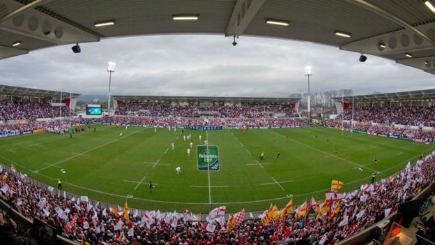 Ravenhill is packed to its new capacity of 18,000 with its redevelopment completed in time for the visit of Saracens
