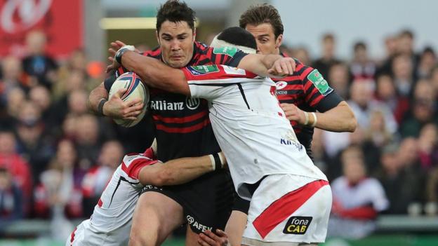 Ulster pair Luke Marshall and John Afoa tackle Brad Barritt as Saracens hold on for a 17-15 victory and a place in the Heineken Cup semi-finals