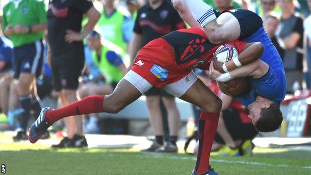 Toulon full-back Delon Armitage is tackled illegally by Brian O'Driscoll