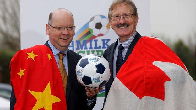 Dale Farm's Stephen Cameron and tournament chairman Victor Leonard celebrate confirmation that China and Canada will compete in the Milk Cup