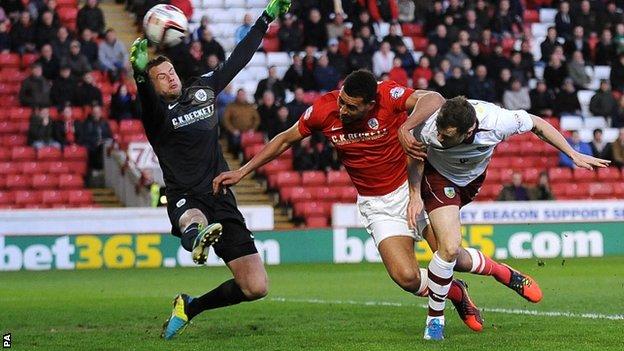 Ashley Barnes heads Burnley into the lead at Barnsley