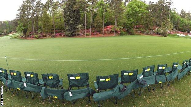 Patrons arrange chairs around Amen Corner during the second round of the 2013 Masters