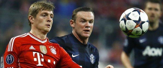 Bayern Munich's Tony Kroos vies with Manchester United's Wayne Rooney