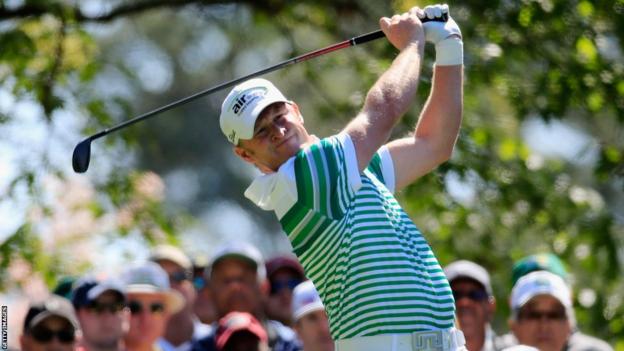Jamie Donaldson watches his tee shot on the fourth hole during the first round