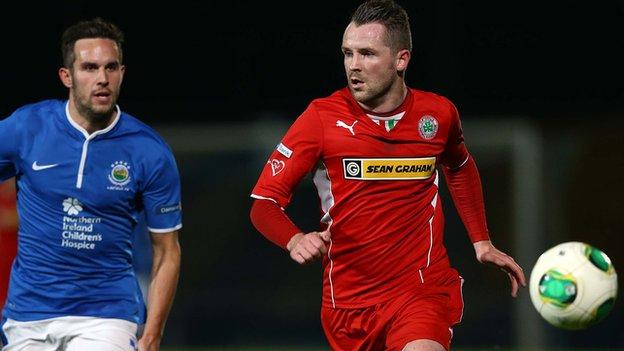 Action from the County Antrim Shield semi-final between Linfield and Cliftonville