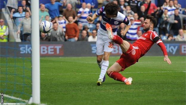 QPR midfielder Yossi Benayoun (left) heads his side ahead against Nottingham Forest