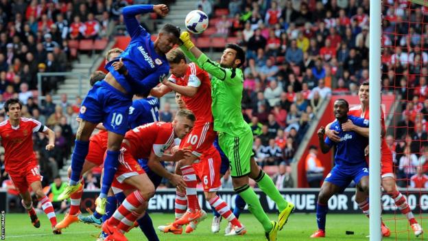 Southampton goalkeeper Paulo Gazzaniga clears off the head of Fraizer Campbell of Cardiff in their Premier League match at St Mary's Stadium