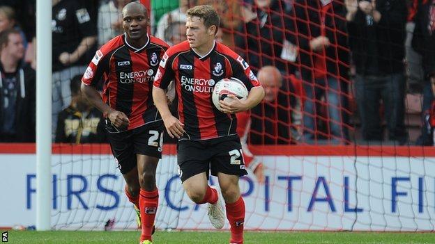 Ryan Frazer (right) turns away after scoring form Bournemouth