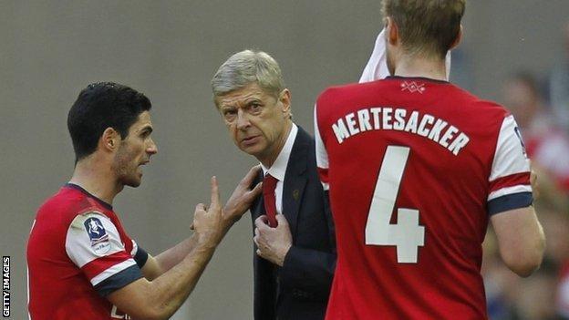 Arsenal manager Mikel Arteta gestures to Gunners boss Arsene Wenger at Wembley