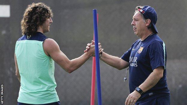 Barcelona's Carles Puyol and Gerardo Martino