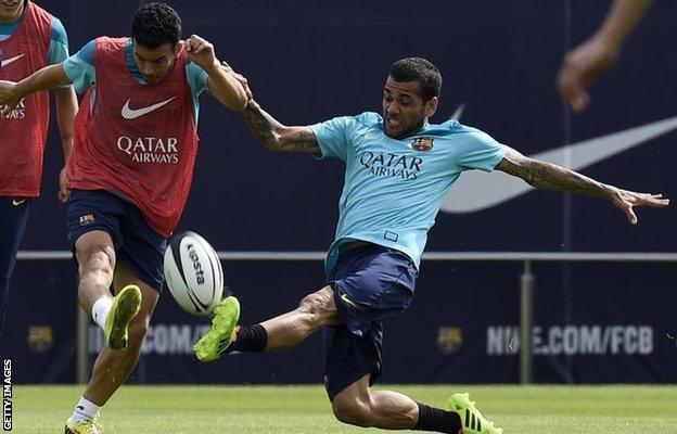 Dani Alves tackles Pedro while playing rugby