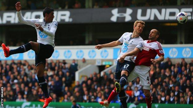 Tottenham striker Harry Kane (second right) heads in his side's second goal against Fulham