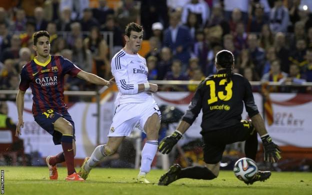 Real Madrid's Gareth Bale scores the winner in their 2-1 win against Barcelona in Spain's Copa del Rey final