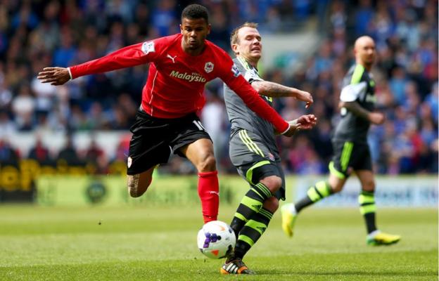 Cardiff City's Fraizer Campbell evades Glenn Whelan of Stoke City in their Premier League clash in the Welsh capital