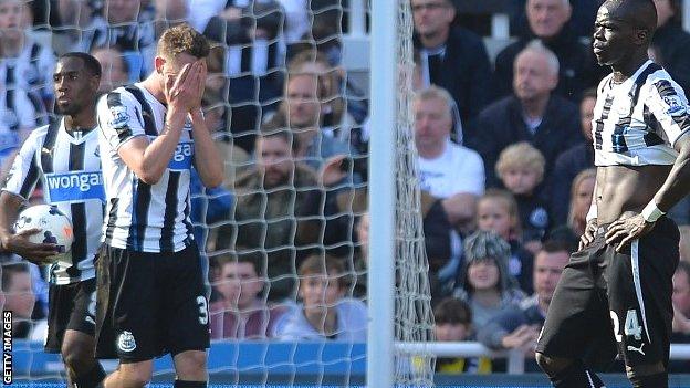 Newcastle players react after losing to Swansea