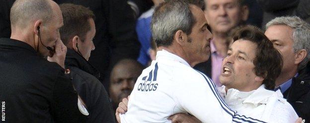 Rui Faria is restrained by Jose Mourinho