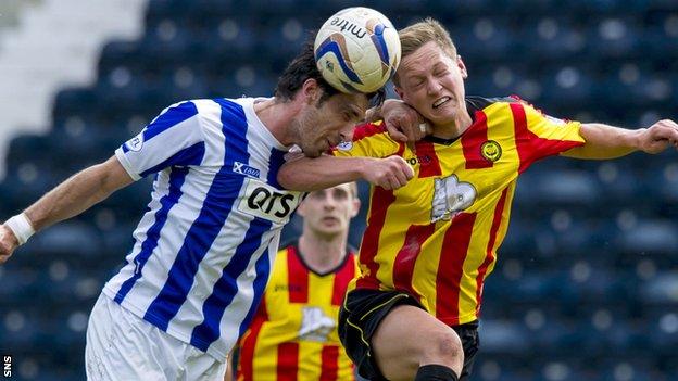 Manuel Pascali battles with James Craigen in the air