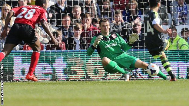 Cardiff's keeper David Marshall saves from Stoke's Oussama Assaidi