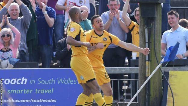 Andy Sandell celebrates with Chris Zebrowski after giving Newport County the lead against Burton Albion in League Two at Rodney Parade on Easter Monday