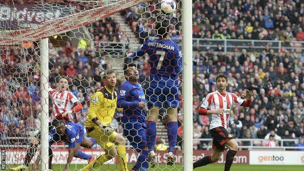 Sunderland striker Connor Wickham (left) watches as his header puts his side in front against Cardiff