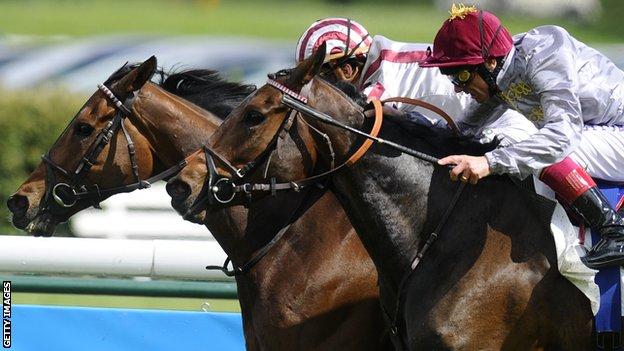 Christophe Soumillon riding Cirrus Des Aigles (L) win The Prix Ganay from Treve and Frankie Dettori