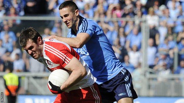 Mark Lynch attempts to break away from James McCarthy at Croke Park