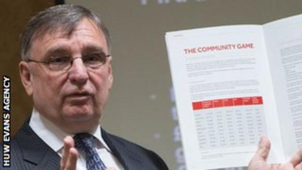 David Moffett holds up a copy of his manifesto for Welsh rugby