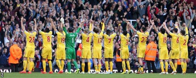 Crystal Palace's players applaud the travelling fans after match against West Ham