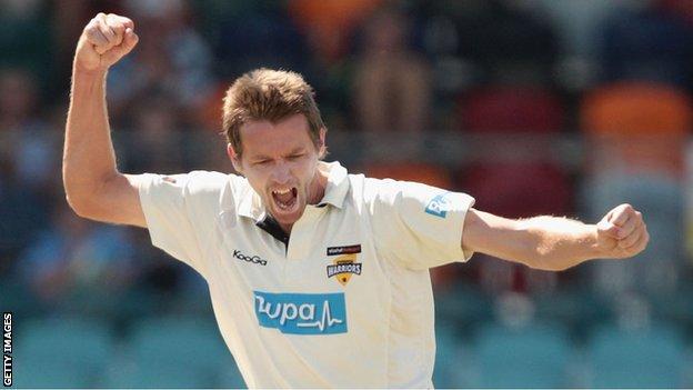 Glamorgan bowler Michael Hogan celebrates taking a wicket