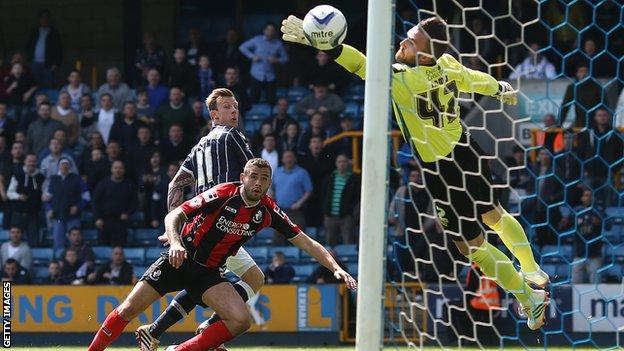 Martyn Woolford glances a header past Lee Camp to give Millwall the lead