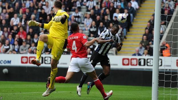 Shola Ameobi scores Newcastle's first goal in their Premier League clash against Cardiff City at St James' Park