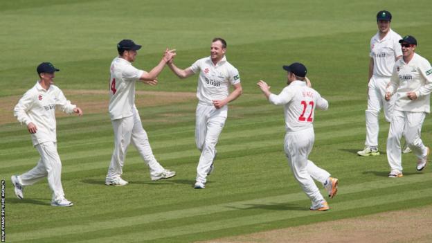 Glamorgan's Graham Wagg celebrates as he takes the wicket of Worcestershire's Alex Hales in the County Championship at Swalec Stadium