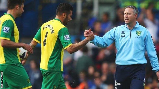 Neil Adams congratulates his Norwich players