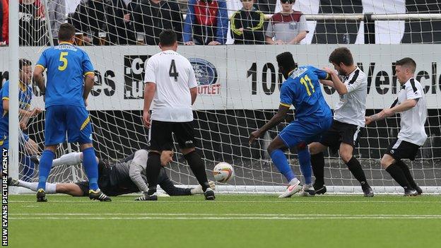 Paulton's Nick McCootie scores