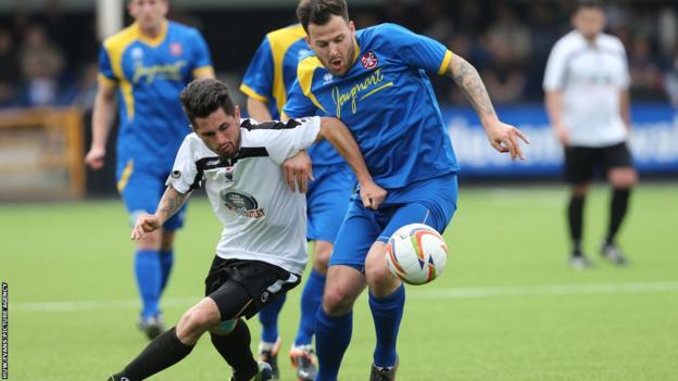 Ian Traylor battles for the ball with Paulton's Marcus Mapstone as Merthyr’s hopes of promotion to the Southern League Premier Division after a 2-0 defeat.
