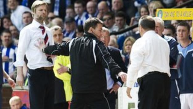 Kilmarnock manager Jimmy Calderwood and Falkirk's Stephen Pressley clash on the touchline
